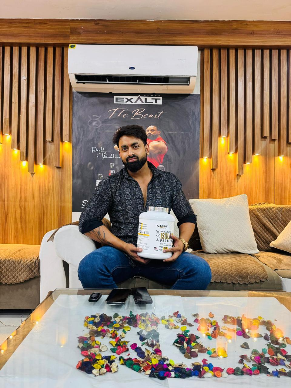 Fitness enthusiast holding SK Nutrition product