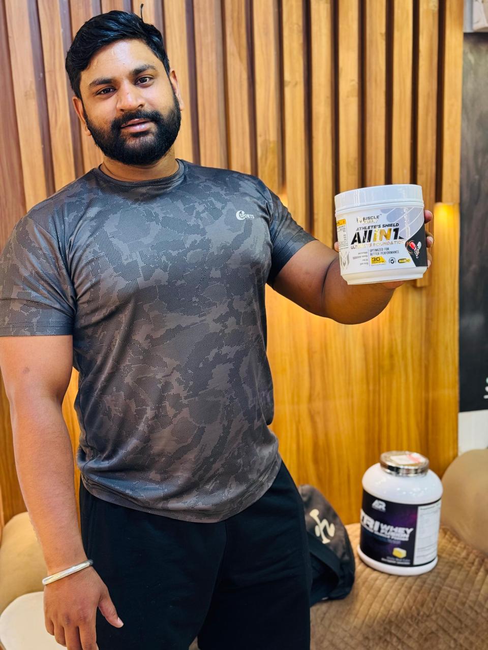 Customer holding All In One supplement